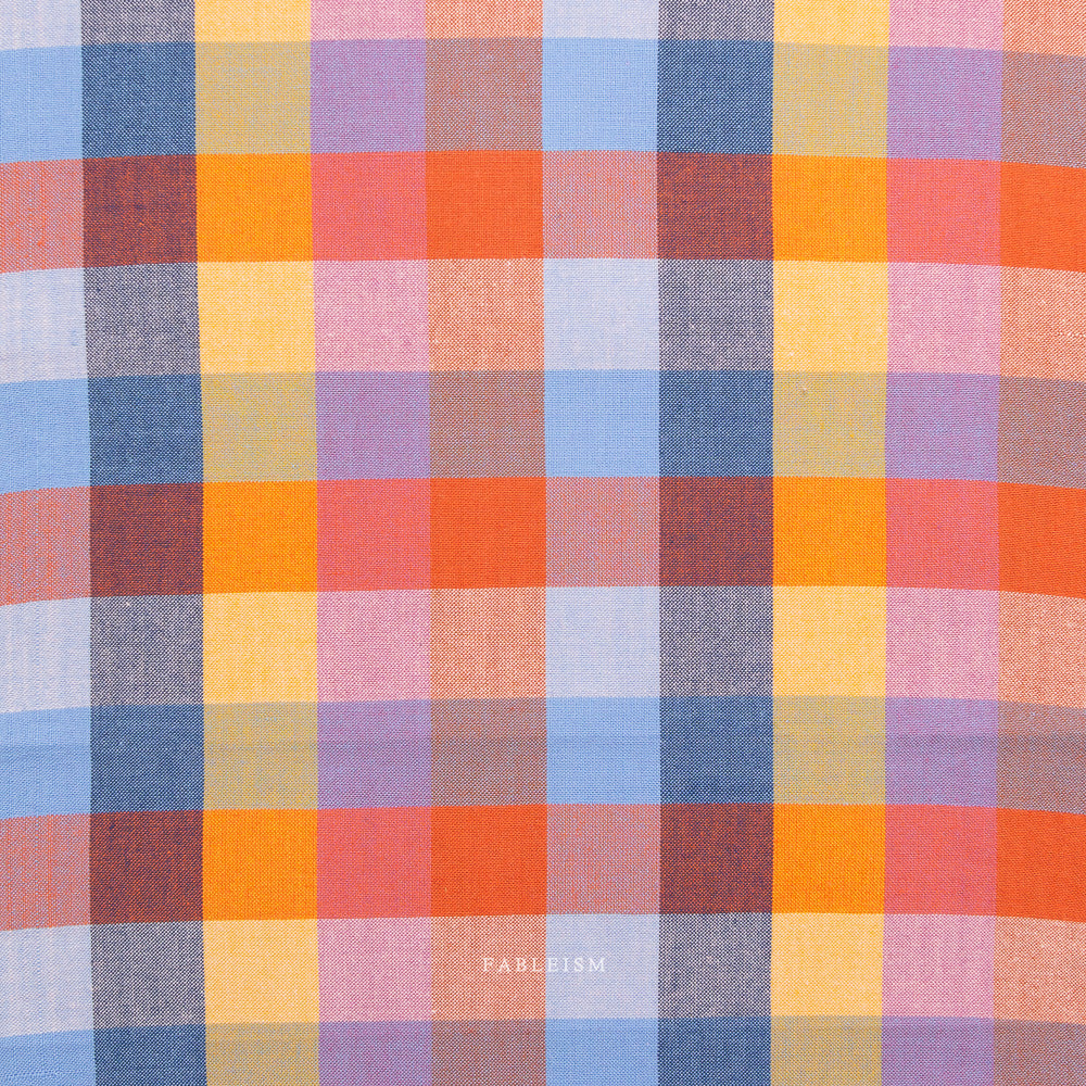 Multicolored checkered fabric pattern with visible brand name 'Fableism'.