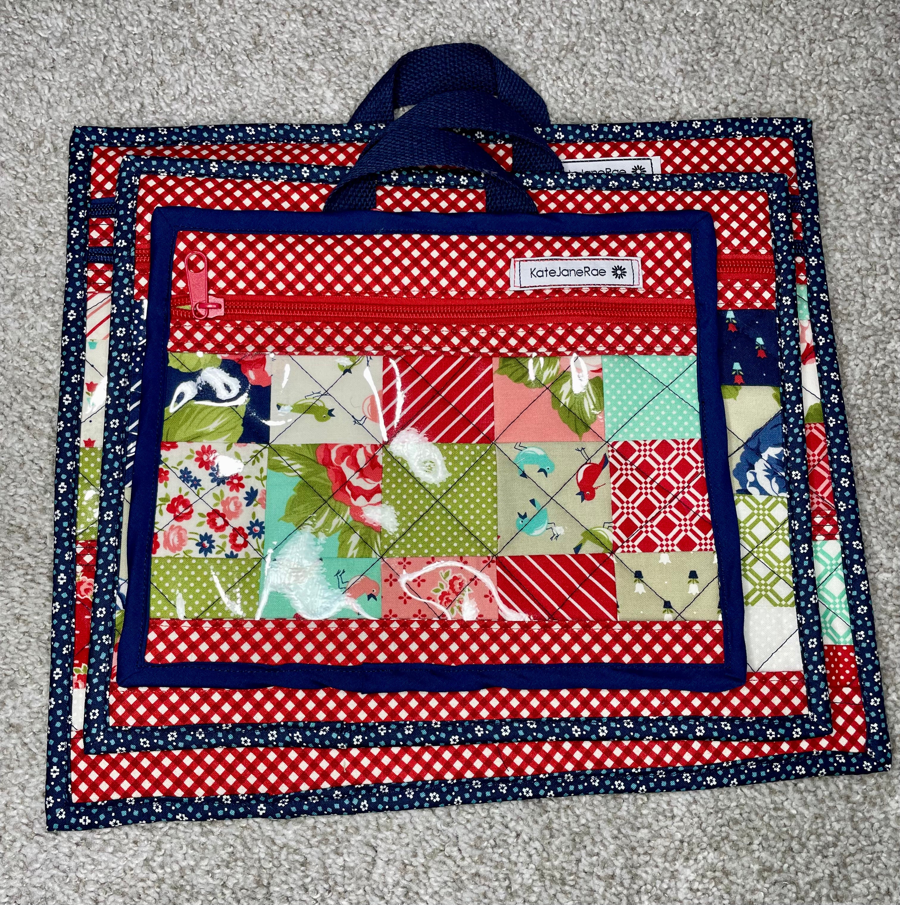 Quilted bag with patchwork design on a gray surface