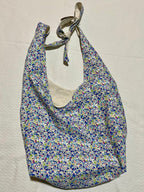 Floral patterned bag on a beige background
