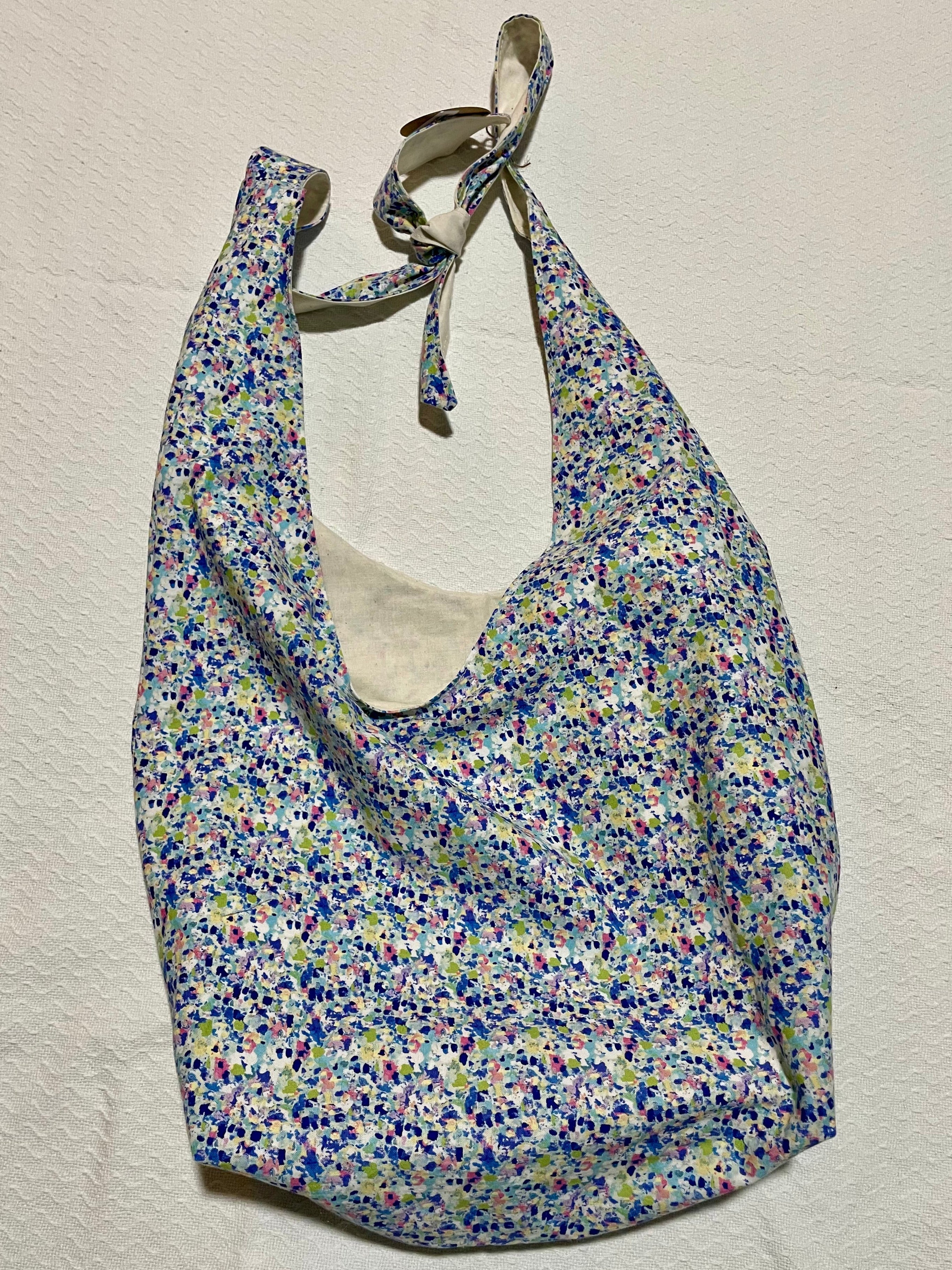 Floral patterned bag on a beige background