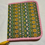 Fabric pouch with floral pattern on a white background