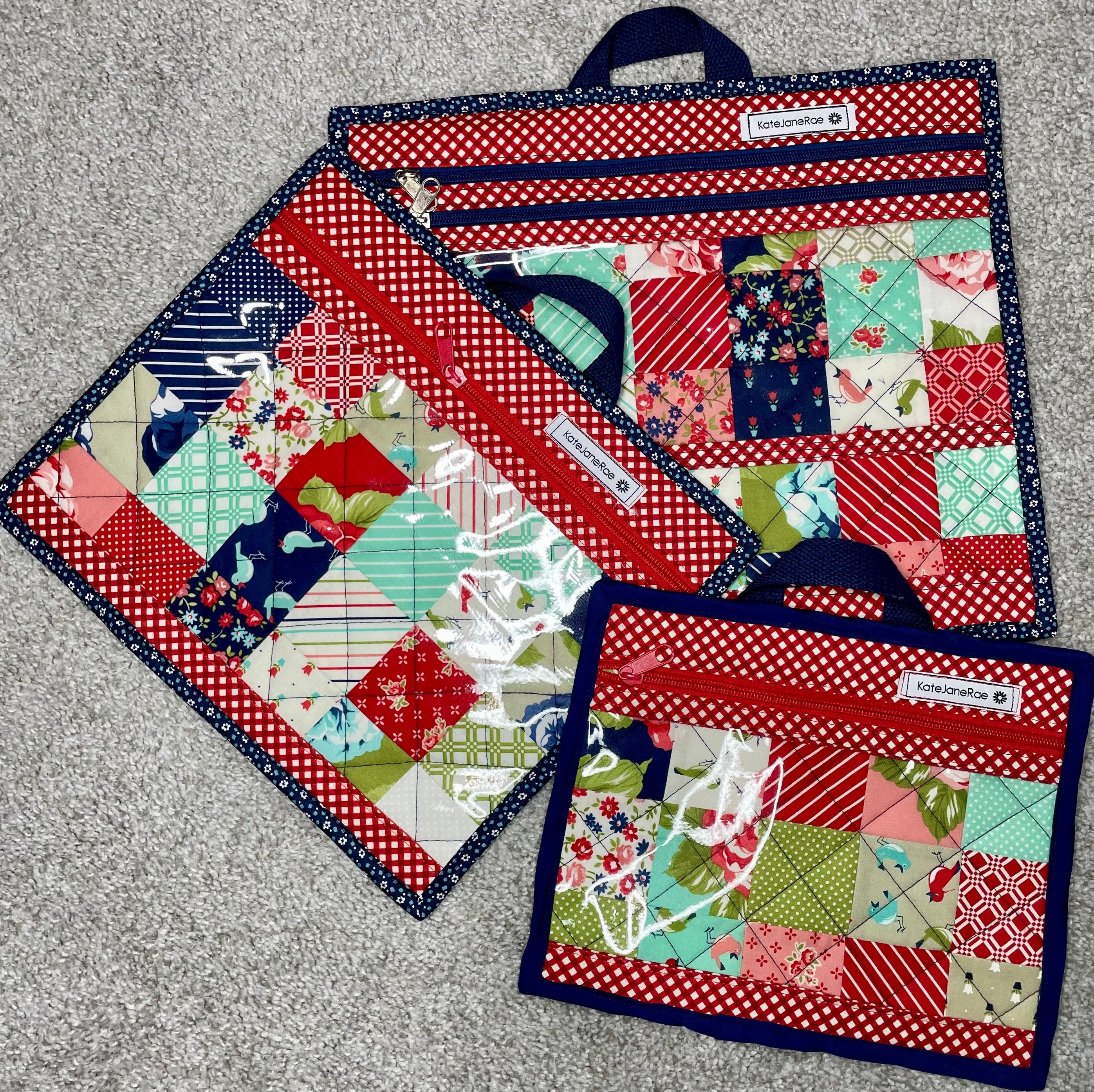 Set of patchwork-style potholders with various patterns on a gray surface
