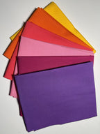 Stack of colorful paper sheets on a white background