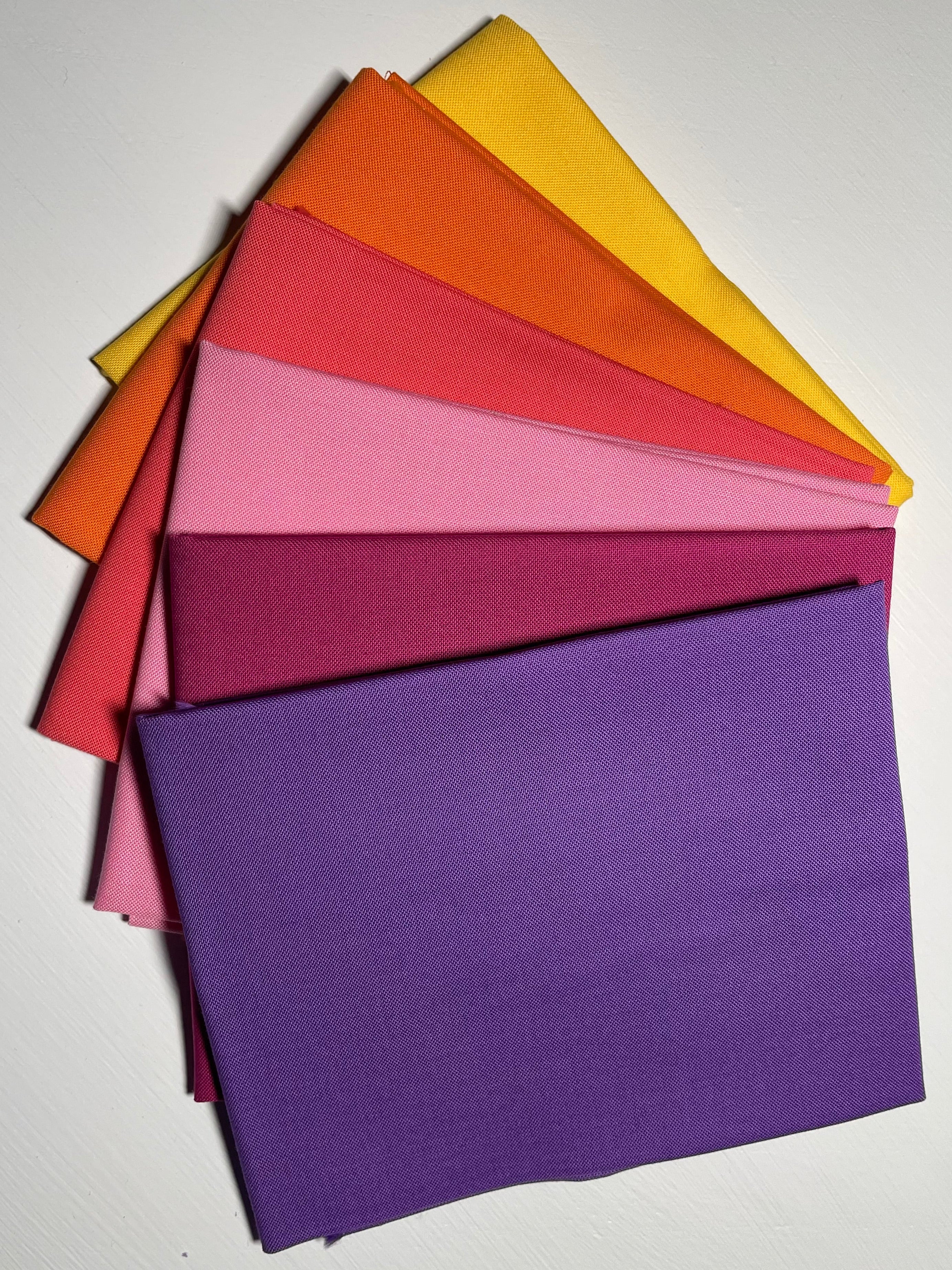 Stack of colorful paper sheets on a white background