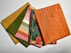 Collection of fabric swatches with various patterns on a white background