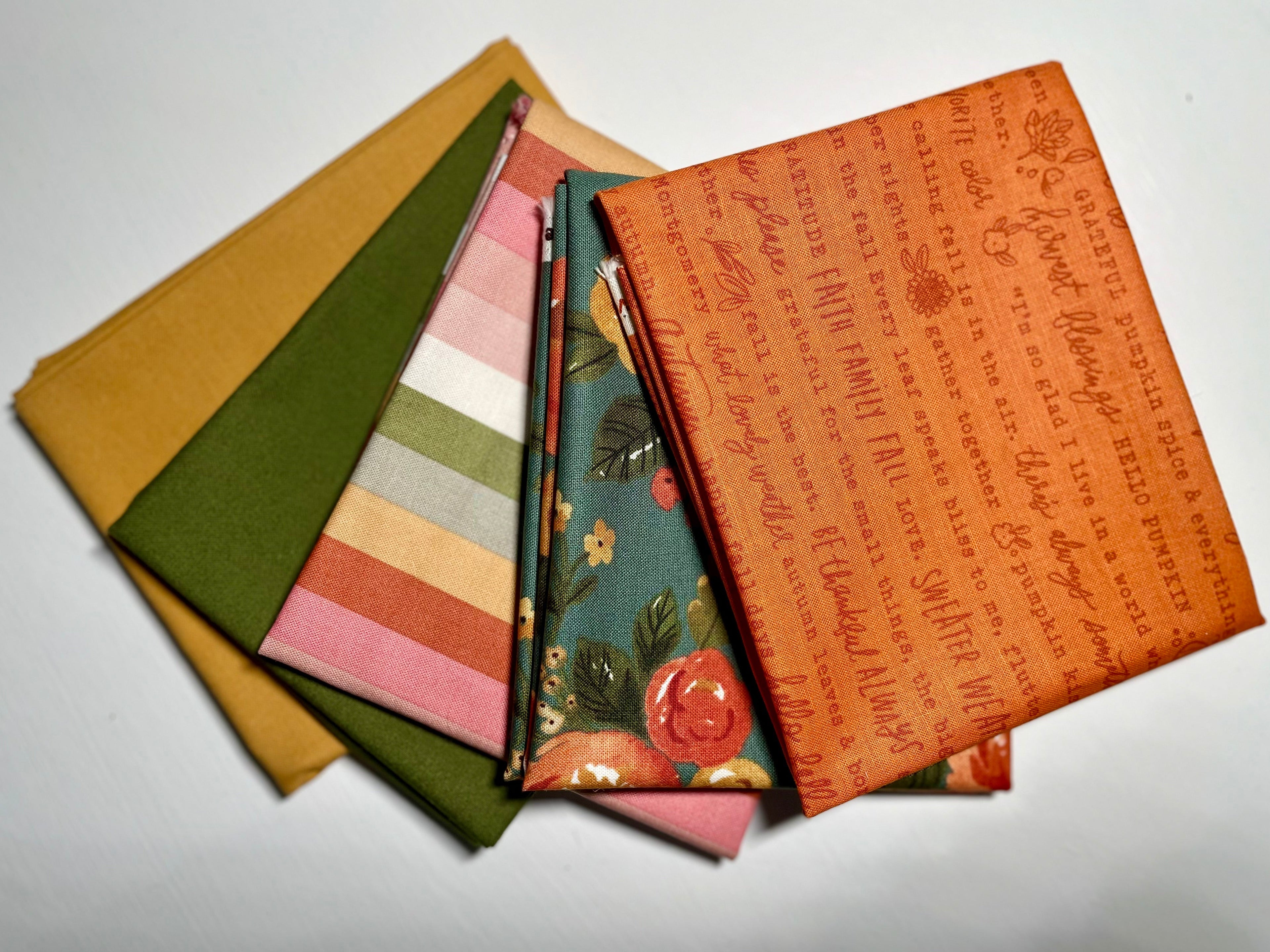 Collection of fabric swatches with various patterns on a white background