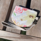 Floral-patterned pouch on a wooden surface