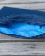 Blue pouch on a wooden surface