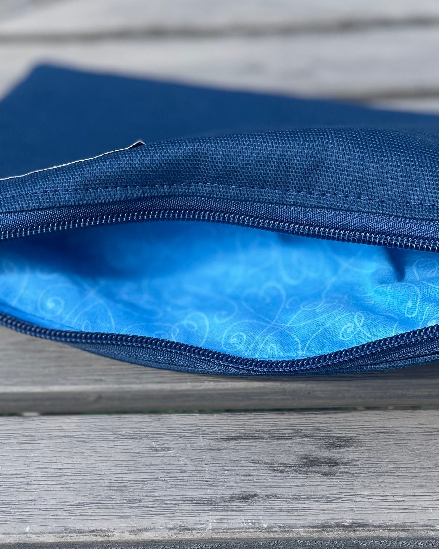 Blue pouch on a wooden surface