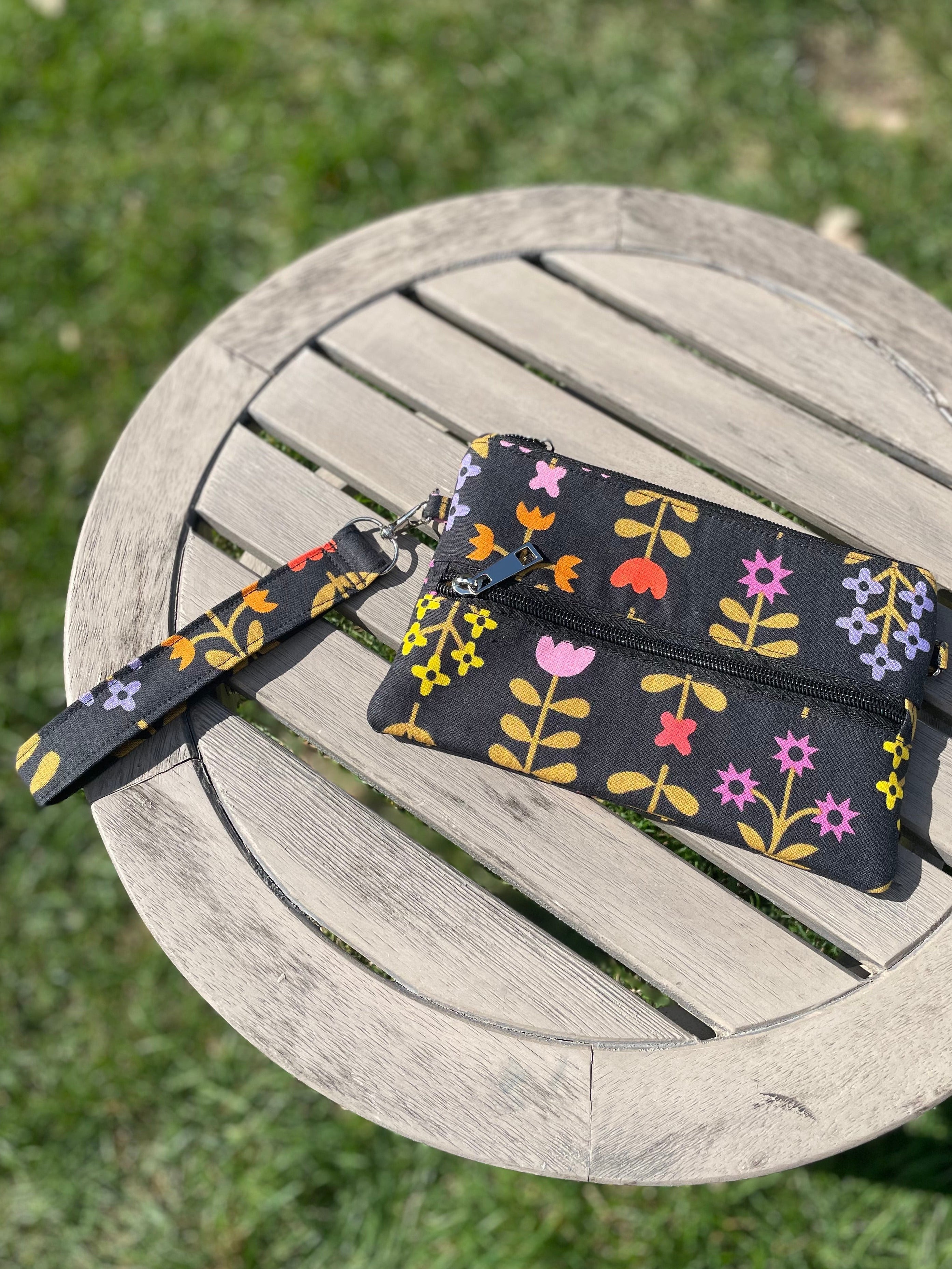 Floral-patterned strap on a wooden chair outdoors