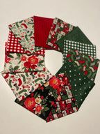 Collection of festive fabric swatches with Christmas patterns on a beige background