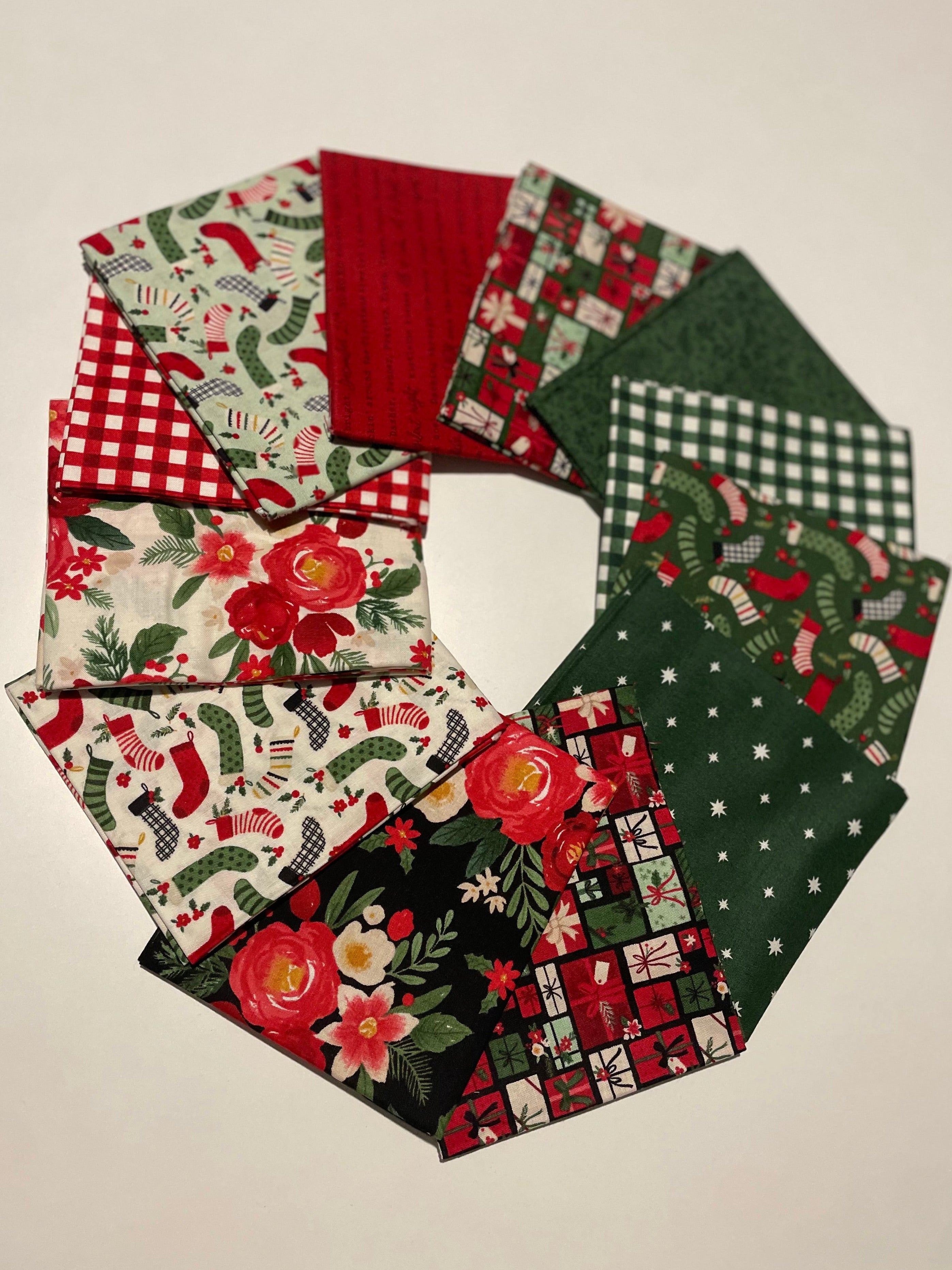 Collection of festive fabric swatches with Christmas patterns on a beige background