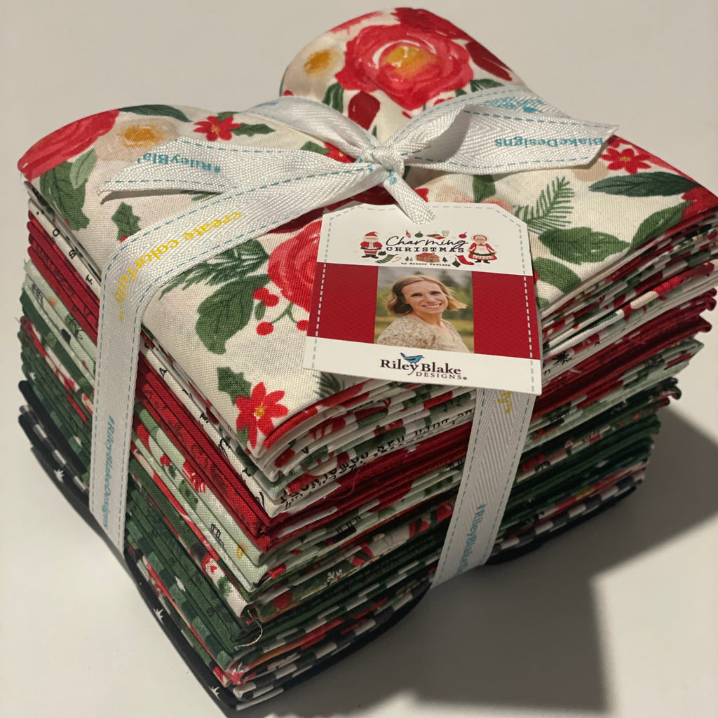 Pack of fabric squares with floral and Christmas designs, tied together with a ribbon.