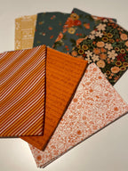 Fall fabric bundle on white table