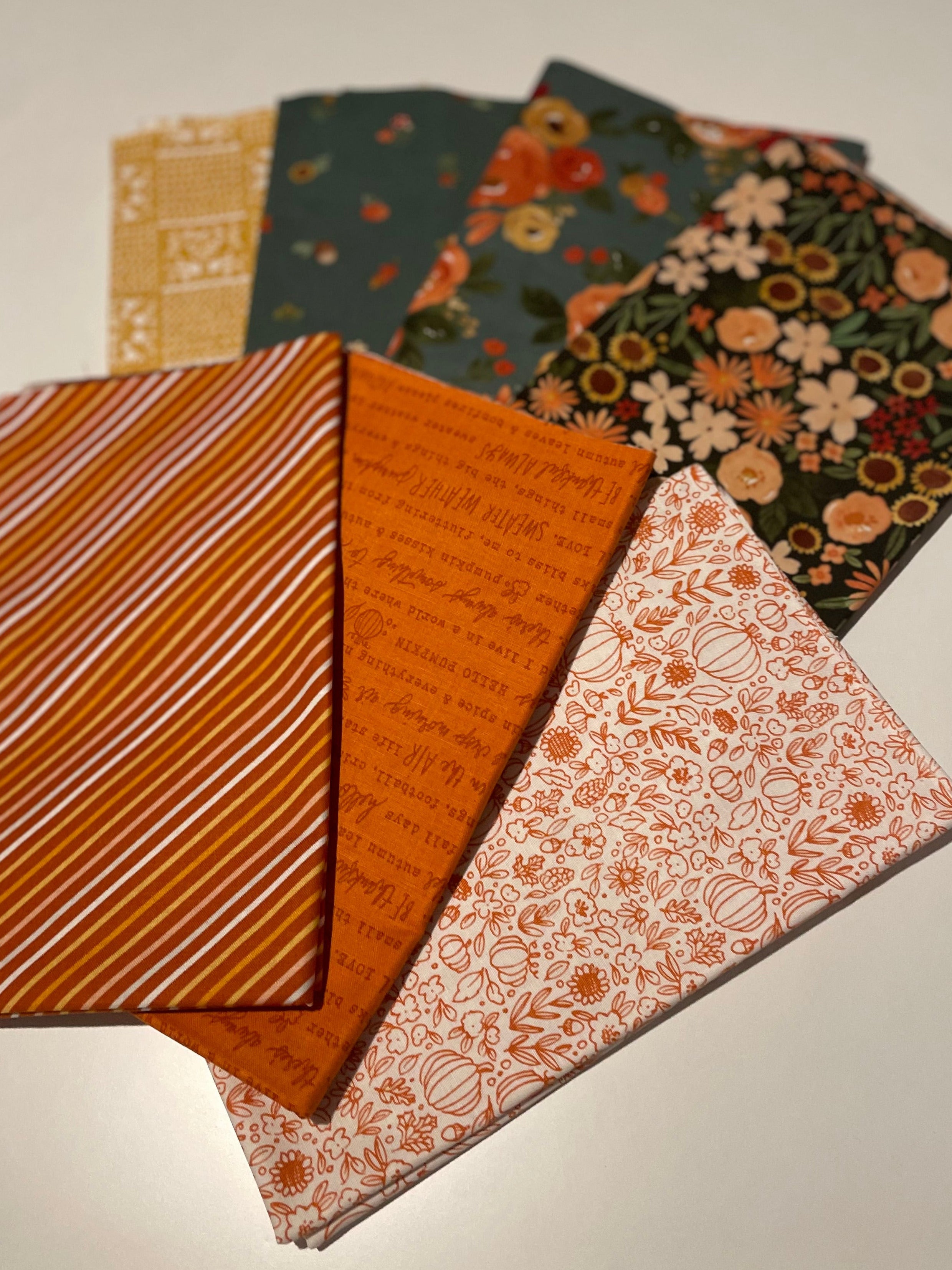 Fall fabric bundle on white table