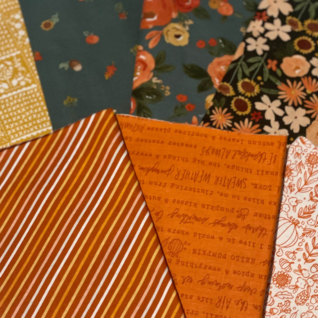 Fall fabric bundle on white table