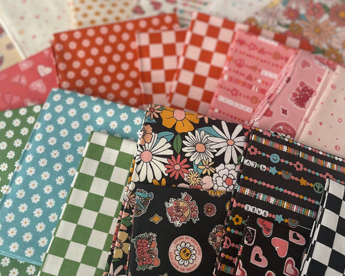 Collection of colorful fabric swatches arranged in a circular pattern on a white surface.