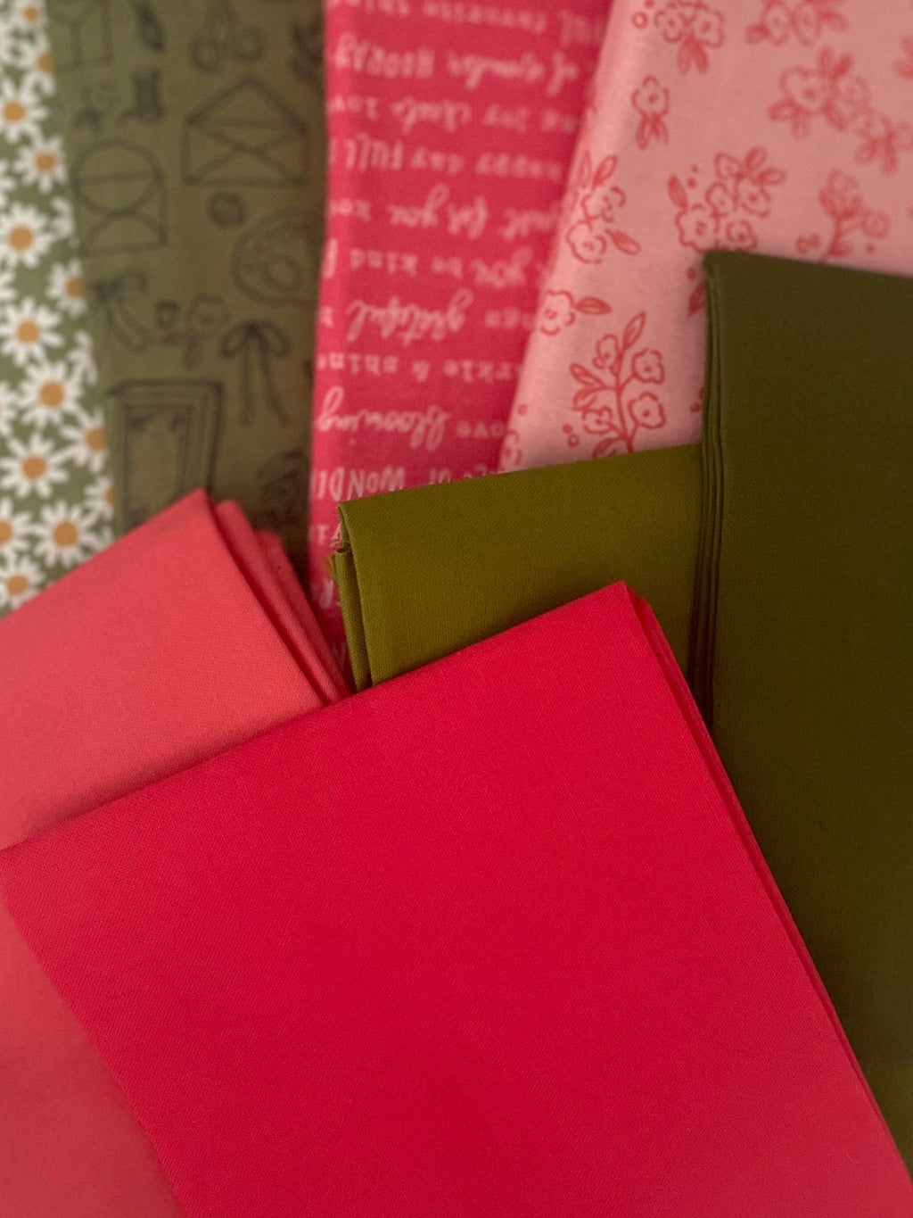 Collection of fabric samples in various colors and patterns on a white background