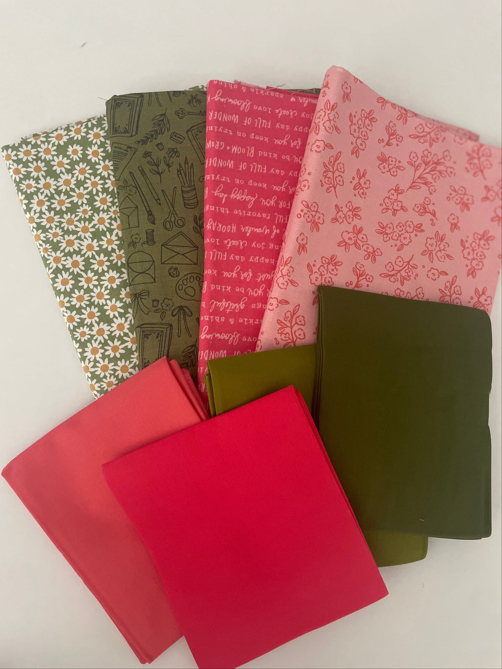 Collection of patterned fabric samples in various colors on a white background