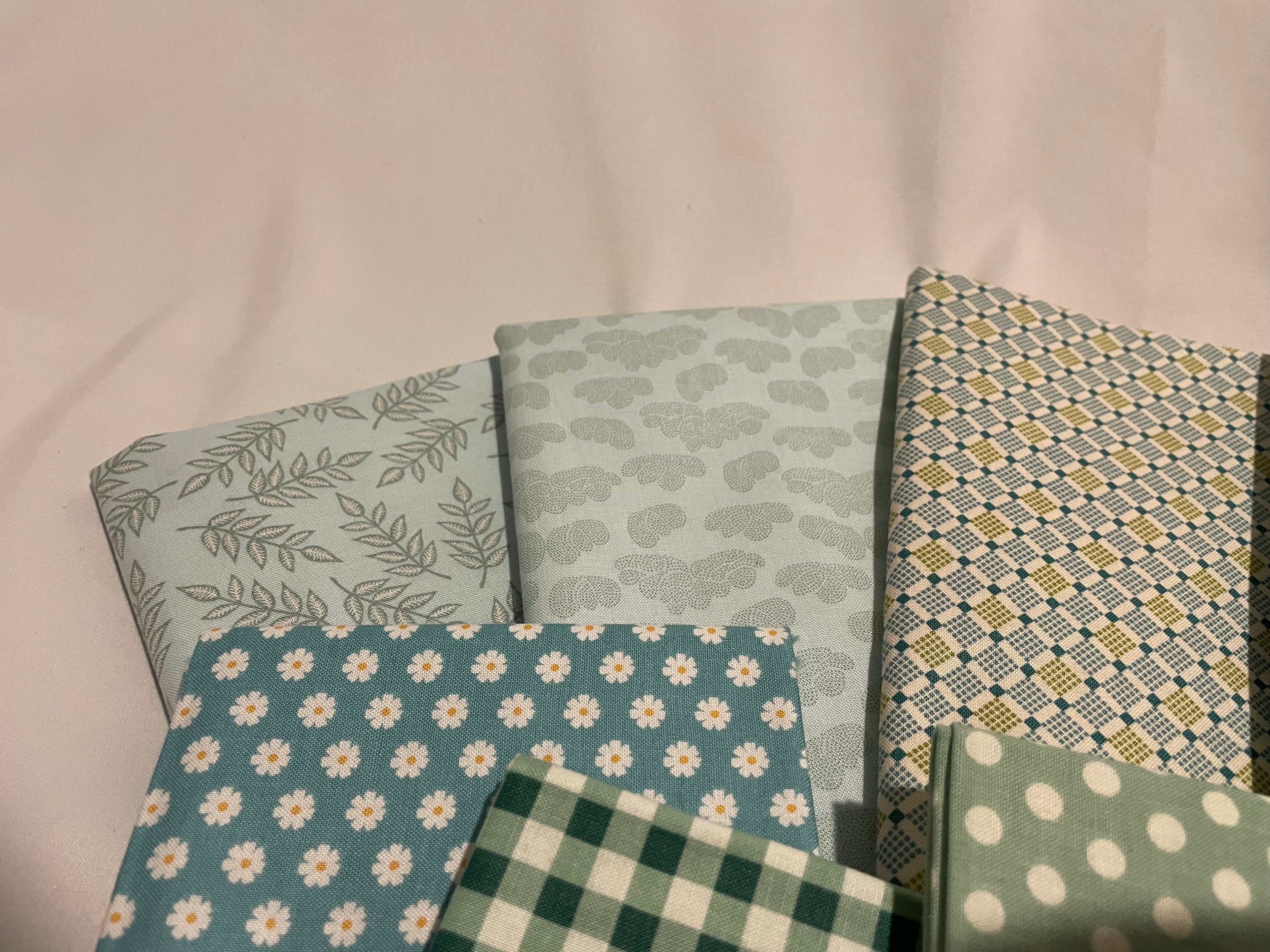 Collection of patterned fabric swatches on a neutral background
