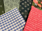 Set of six patterned notebooks arranged on a white background