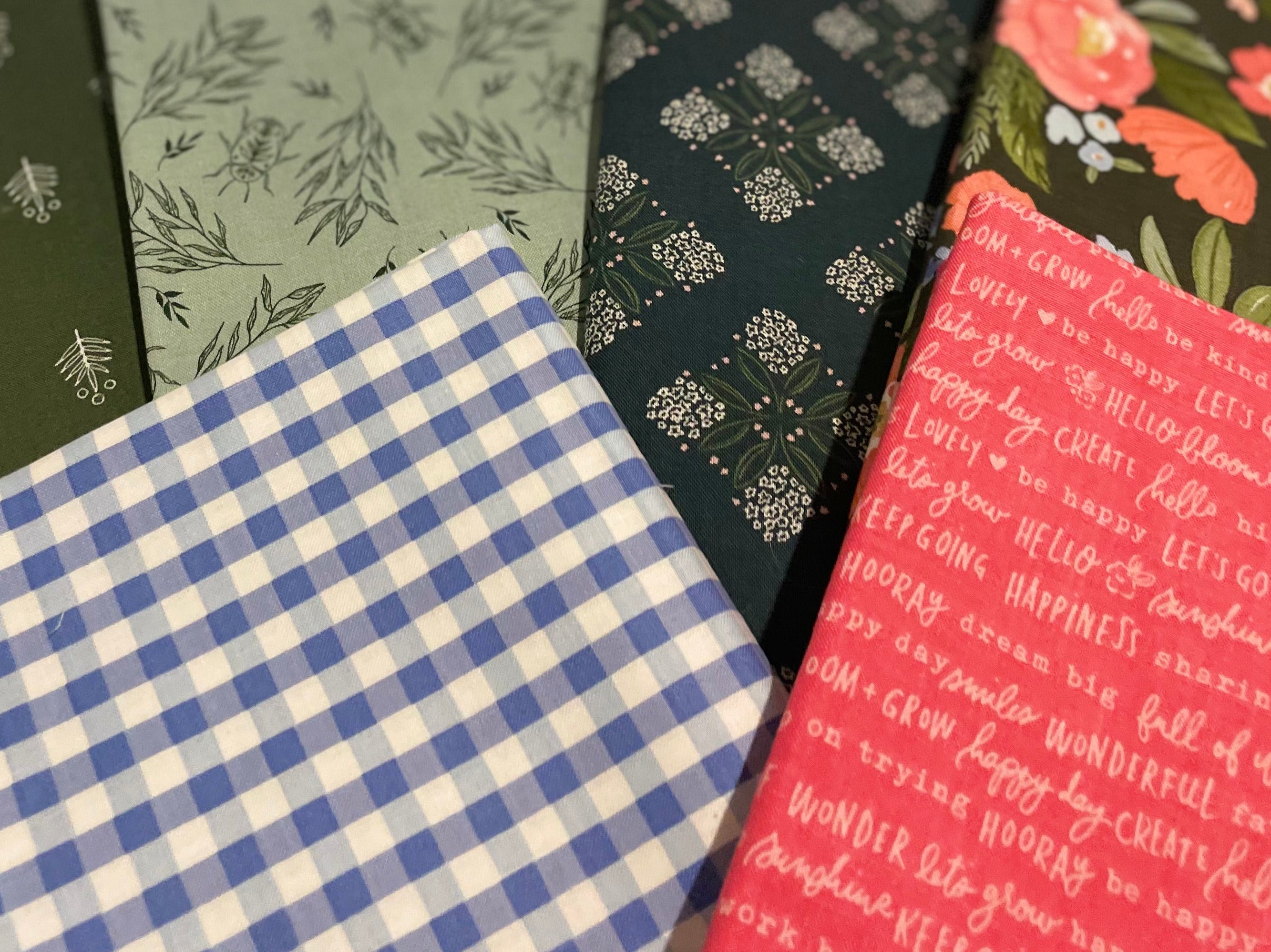 Set of six patterned notebooks arranged on a white background