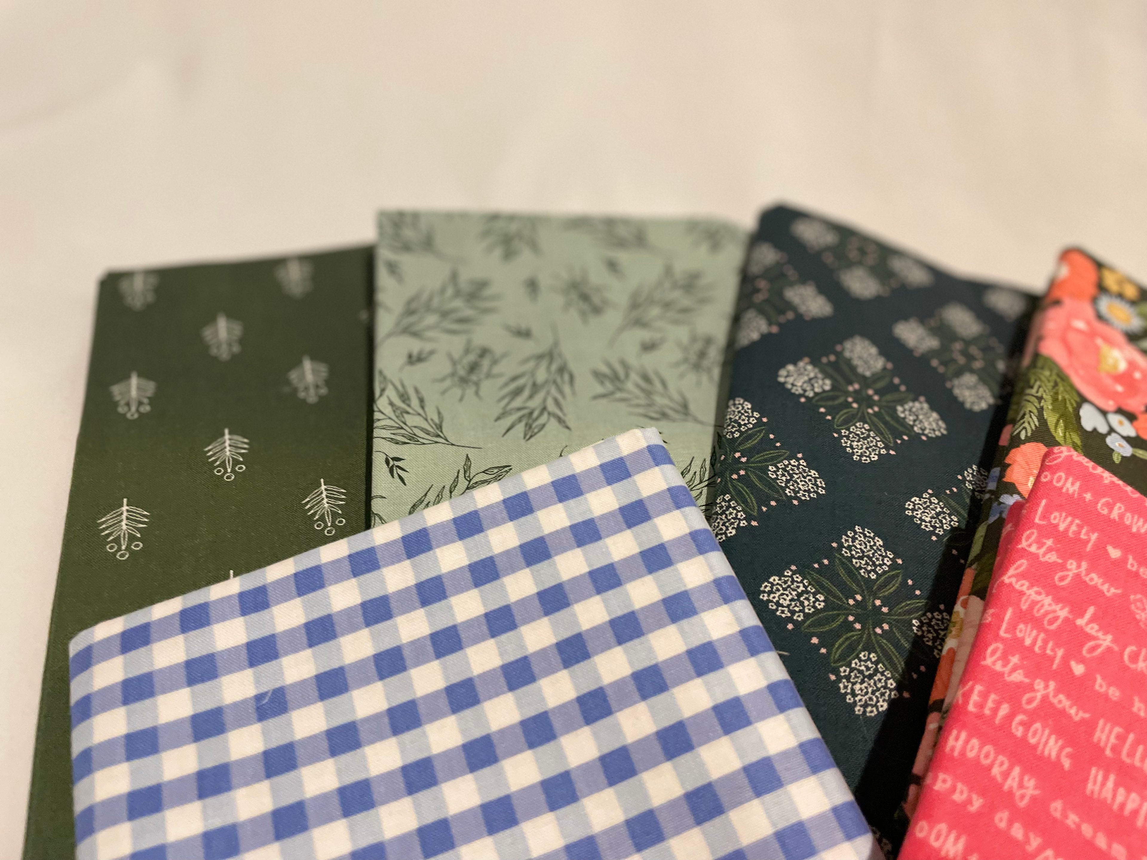Collection of patterned notebooks on a light background