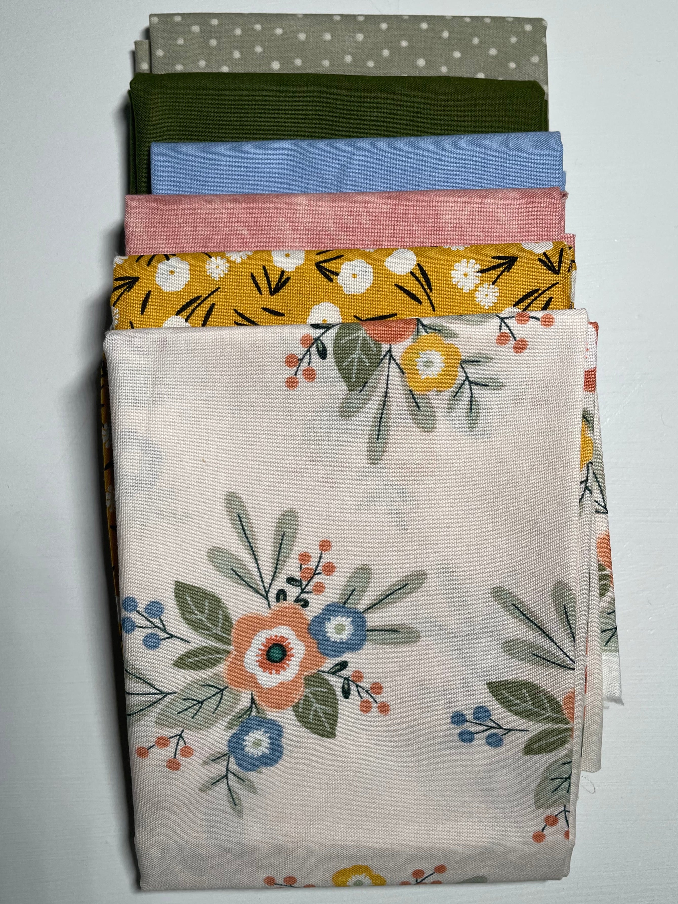 Colorful fabric bundle on white table