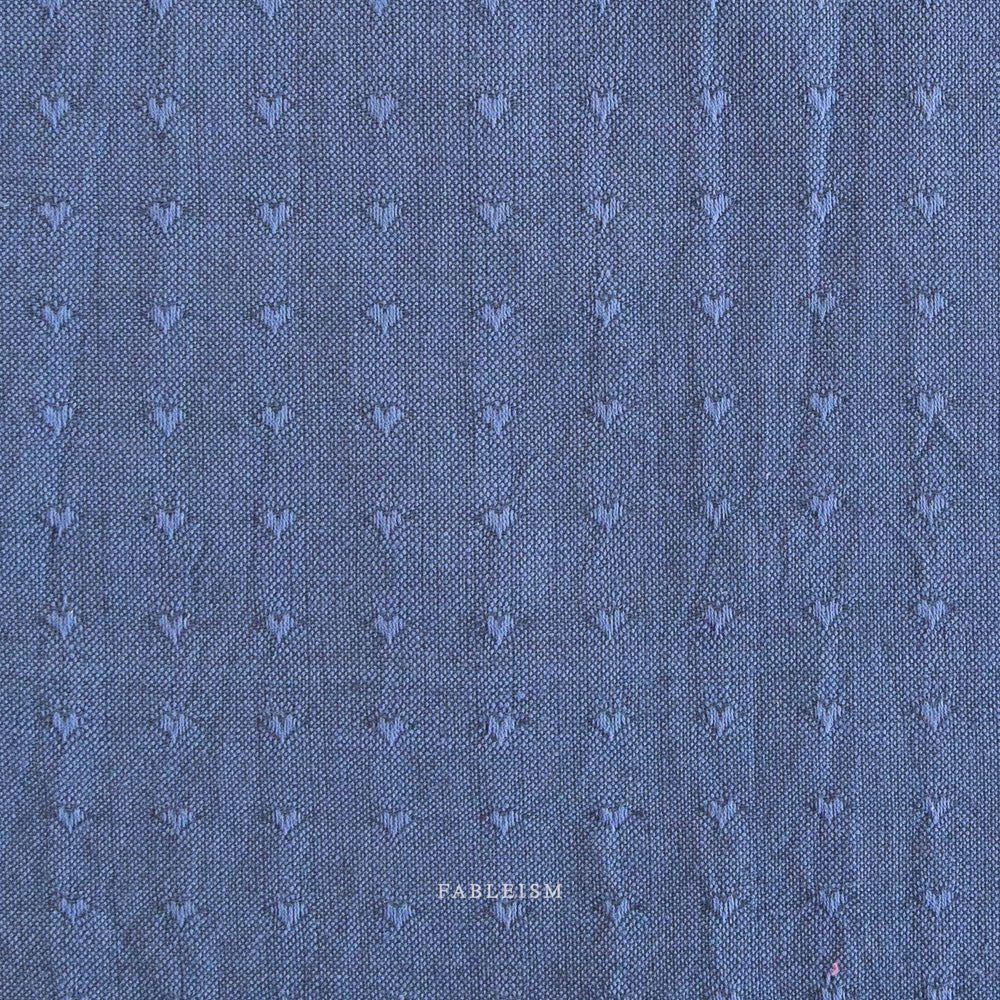 Blue fabric with a subtle pattern and 'Fableism' branding.